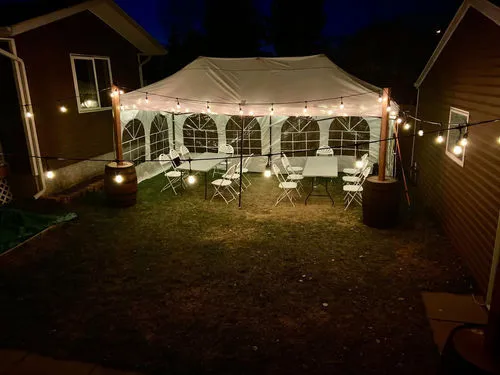 10 x 20 Popup Tent with Walls 2 8 ft Tables and 18 Chairs