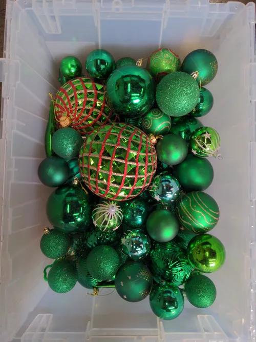 Bin of Assorted Green Ornaments