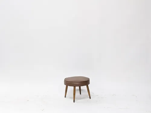 Round Hazelnut Brown Leather Ottoman