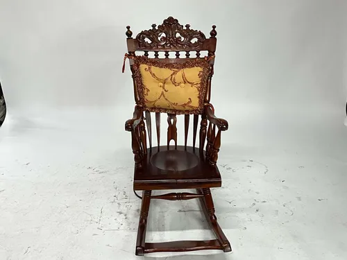 Ornate Carved Wood Rocking Chair with Red & Gold Cushion