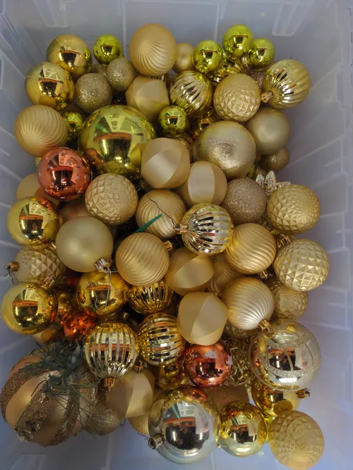 Bin of Assorted Gold Ornaments
