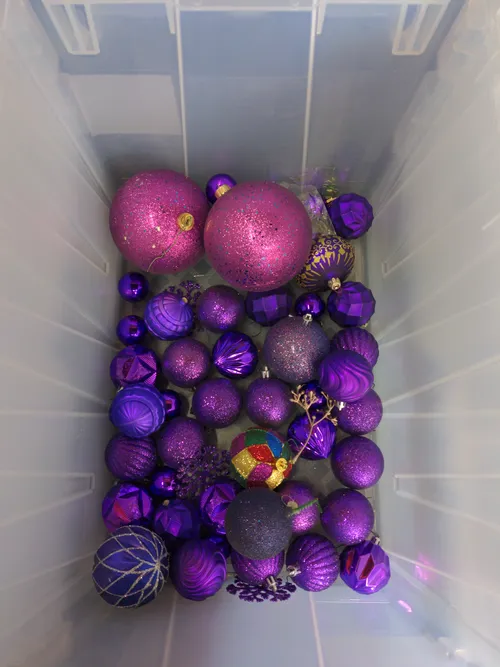 Bin of Assorted Purple Ornaments