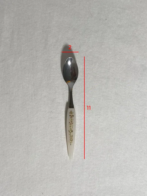 Cucchiaino manico bianco in plastica