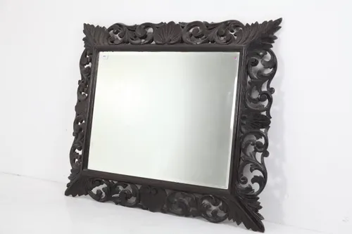Carved wall mirror