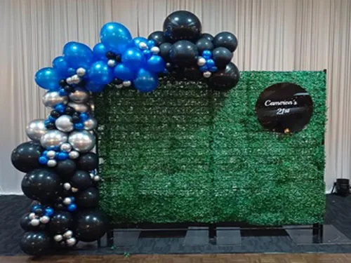 Large Green Wall with Organic Balloon Garland with Hanging Acrylic Round Sign