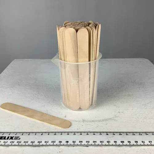 Quantity of Wooden Tongue Depressors in Plastic Measuring Beaker