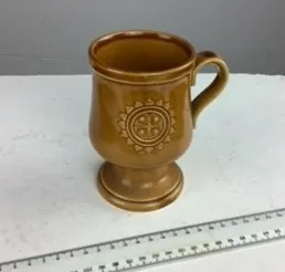 Brown Mug with Raised Sun Design