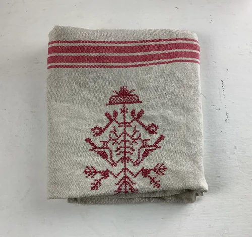 Red and cream embroidered tea towel 