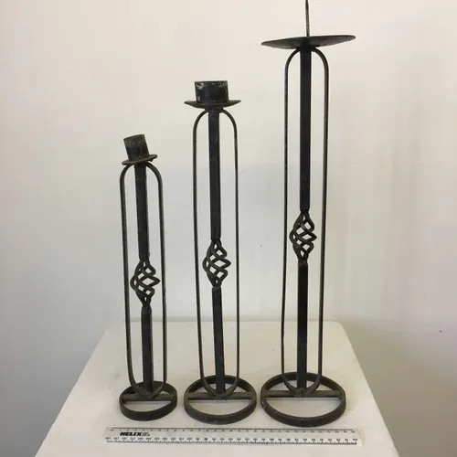 Set of three rustic wrought iron candlesticks 