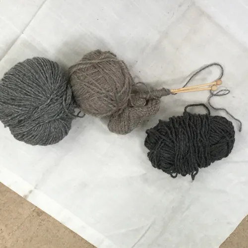 Knitting needles and balls of wool