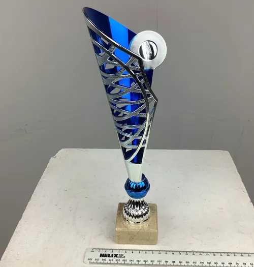 Blue and Silver Trophy on Cream Marble Stand