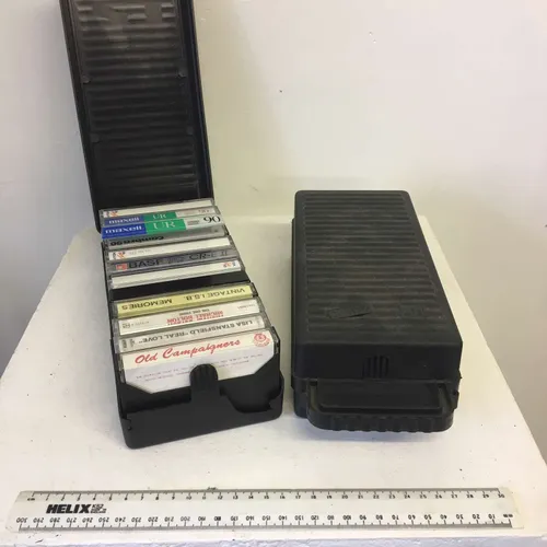 Black plastic cassette carry cases/boxes with cassette tapes
