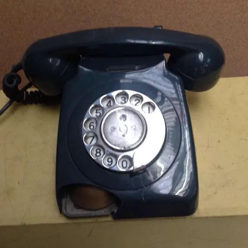 dark green GPO corded rotary dial telephone