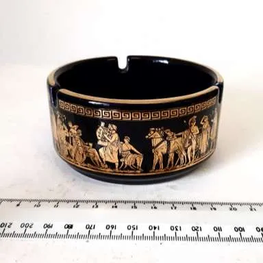 Glazed black and gold ashtray with Greek design