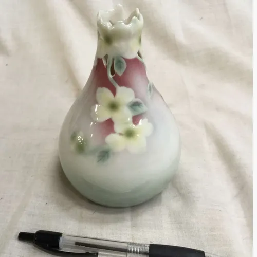 White bulb vase with embossed flowers 