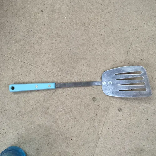 Metal spatula with blue handle 