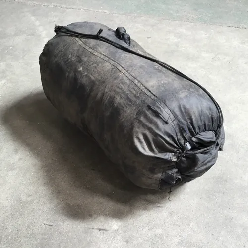 Black Sleeping Bag in Dirtied Sleeve