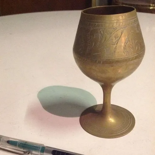 brass goblet with etched decoration