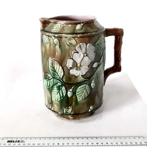 Tall Glazed Ceramic Brown Majolica jug with flower and leaf design