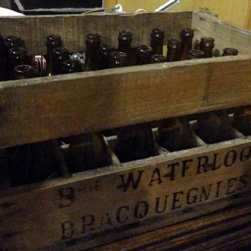 Period beer bottles in wooden crate