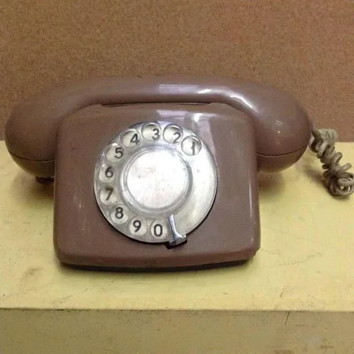brown corded rotary dial telephone