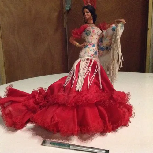 Spanish female dancing figurine / doll wearing red flamenco dress and peineta
