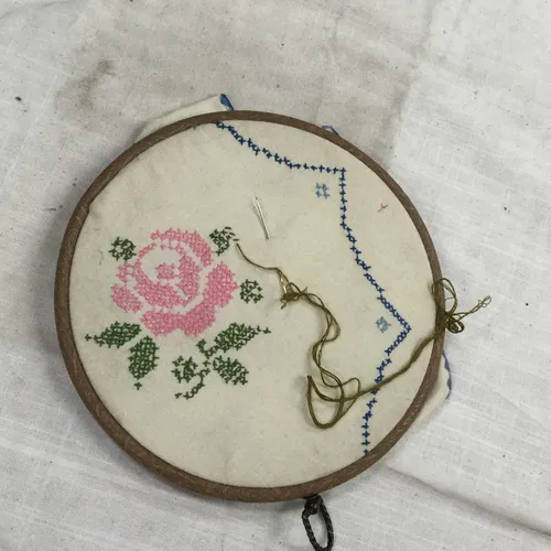 Embroidery hoop with cross stitch rose