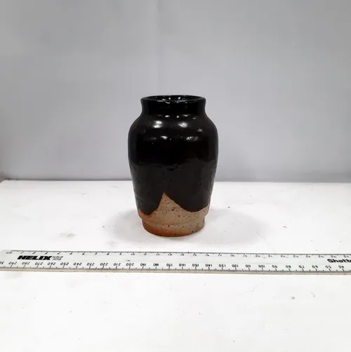 Small black and white ceramic stoneware vase