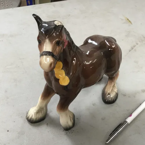 Ceramic horse (ear missing)