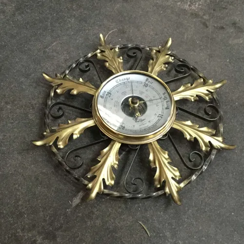 Gold and black iron barometer