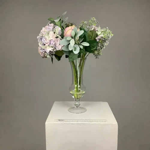 Tall glass vase with faux flowers 