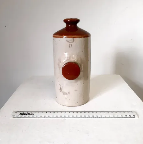 Brown and cream stoneware hot water bottle bed pig