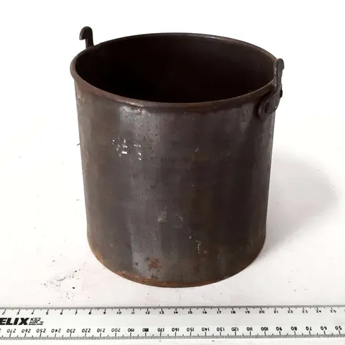 Small rusted metal bucket (handle missing)