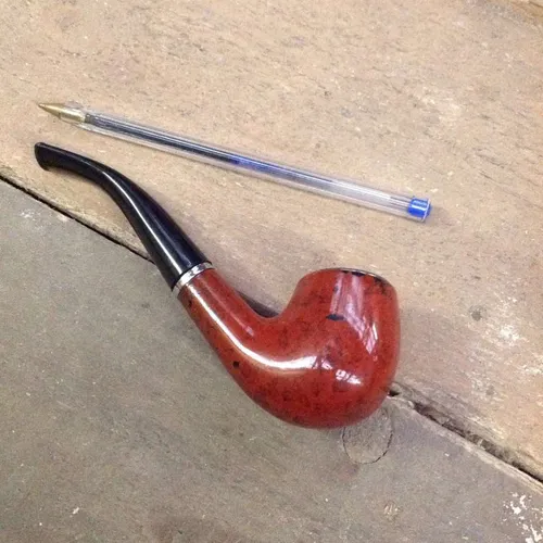 brown and black full bent pipe