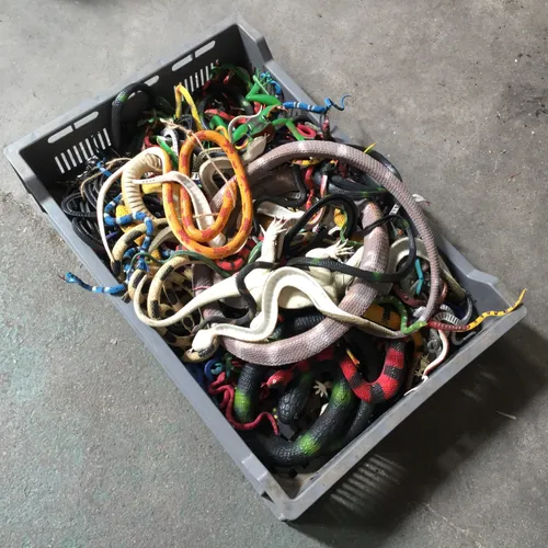 Box of Assorted Toy Snakes and Lizards