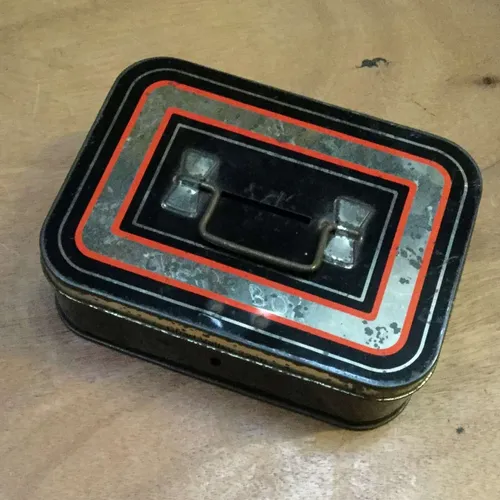 Small tin money box