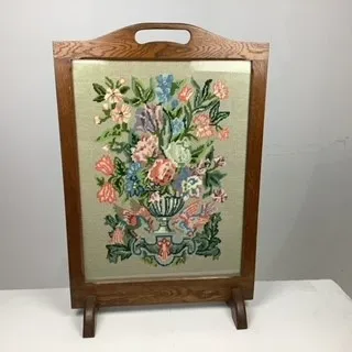 Embroidered floral fire guard
