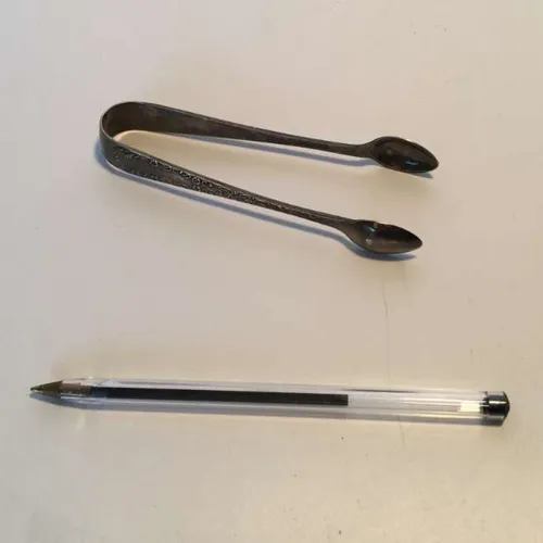 small ornate period silver sugar tongs