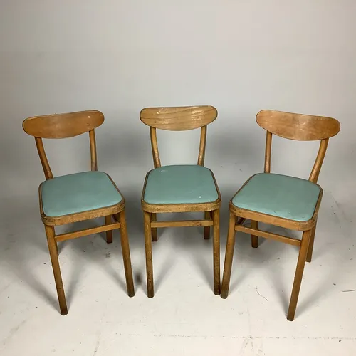 Blue cushioned wooden chair