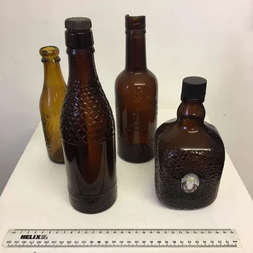 Period brown glass bottles in varying sizes