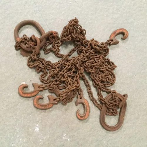 Heavy Rusted Metal Chain with Faded Orange Hooks