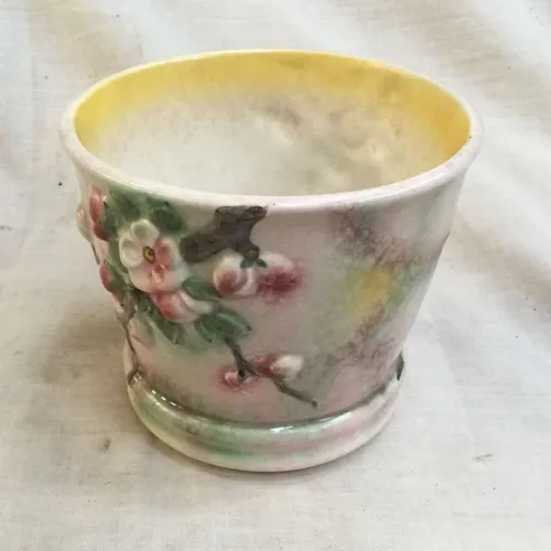 Ceramic planter with embossed flower