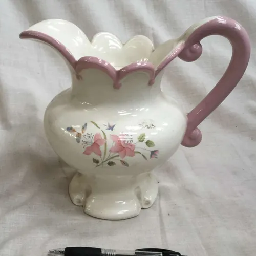 White jug with floral detail, large handle and pink trim