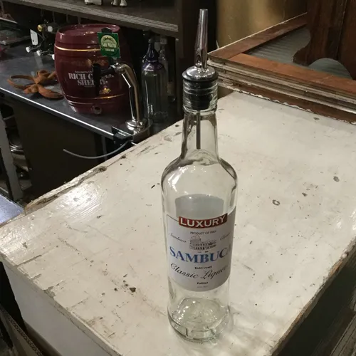 Clear glass sambucca bottle