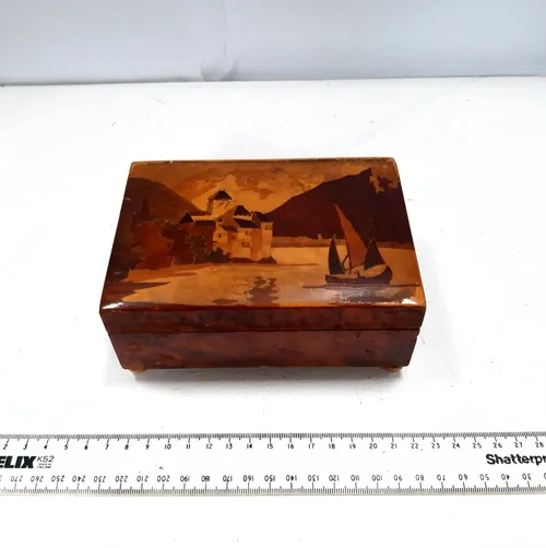 Wooden music box with castle and boat design