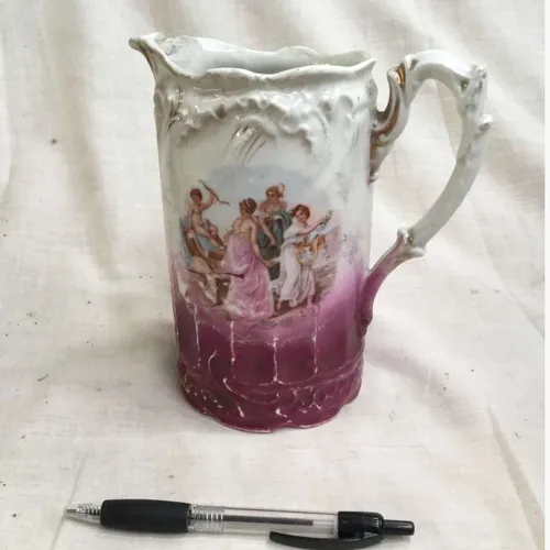 White and pink/purple jug with painted ladies detail and gold trim