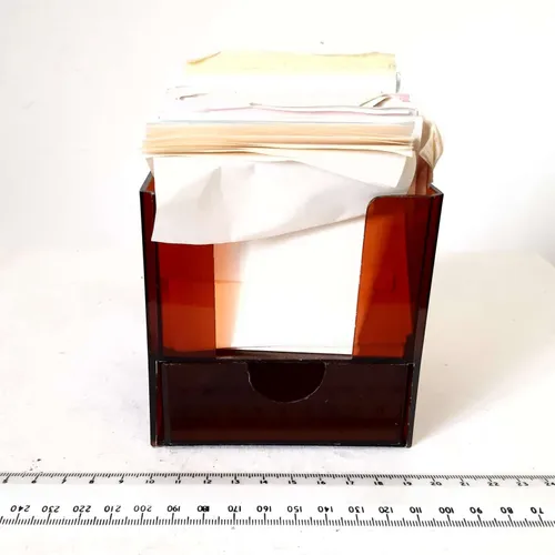 Brown plastic notelet holder with post-it note paper
