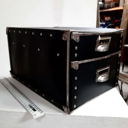 Large black cardboard drawers with metal handles