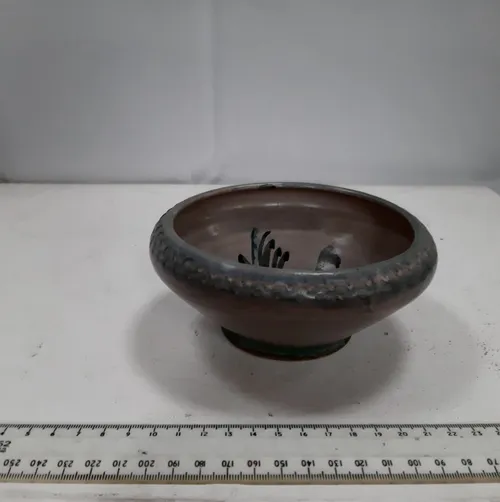 Small grey/purple ceramic bowl with flower design