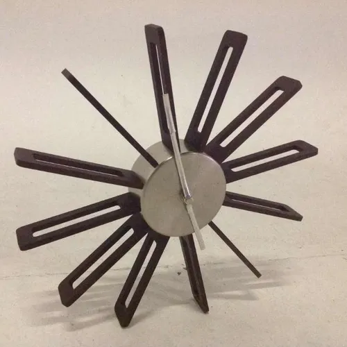 wooden and metal analogue wall clock with no numbers